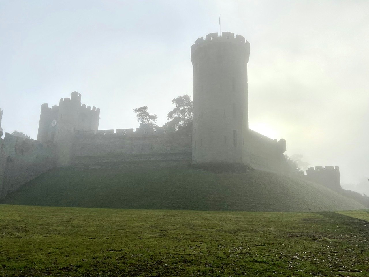 The castle with lots of fog and a clearing sky